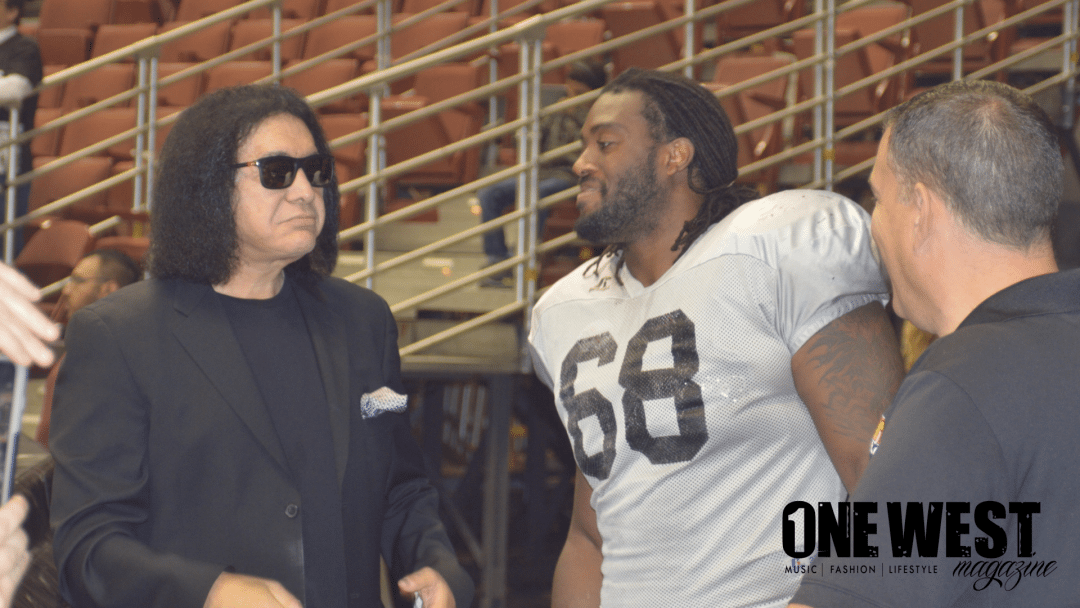 Gene Simmons Chats With Player At Intrasquad Scrimmage